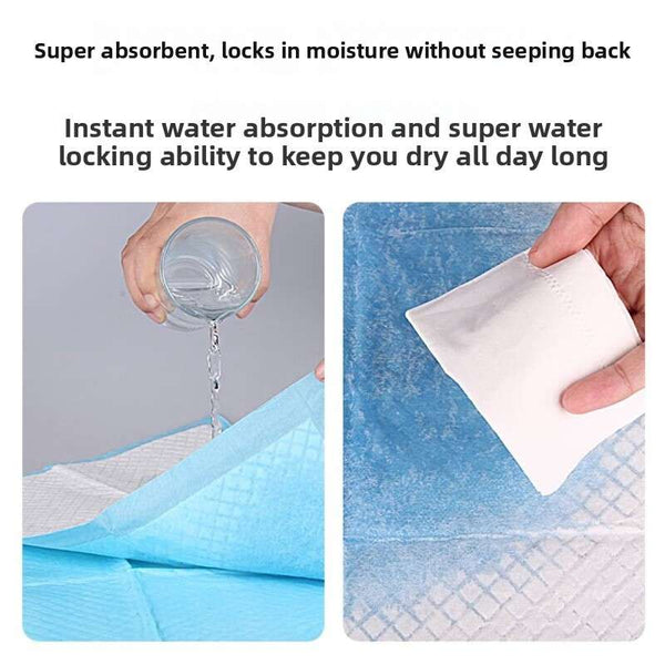 Blue pet training pad stack with hands showing water absorption through the top sheet