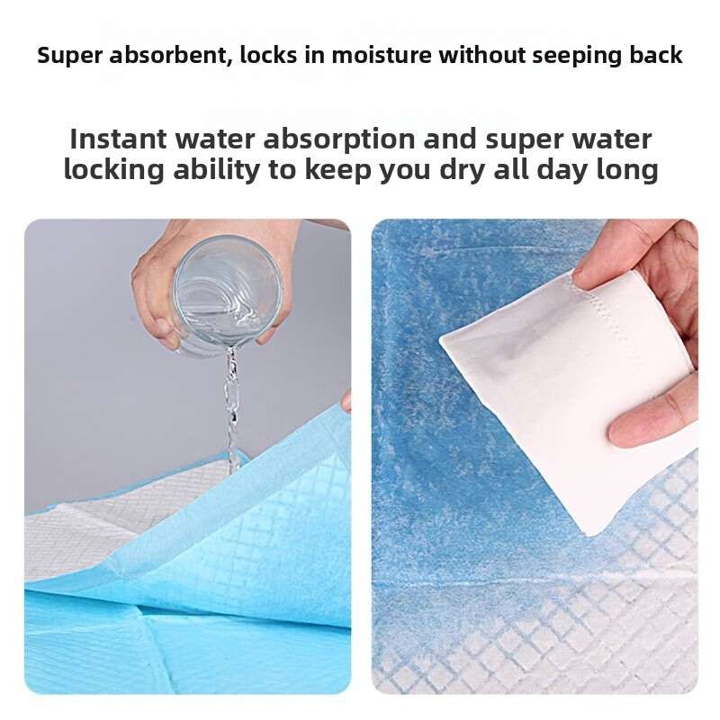 Blue pet training pad stack with hands showing water absorption through the top sheet