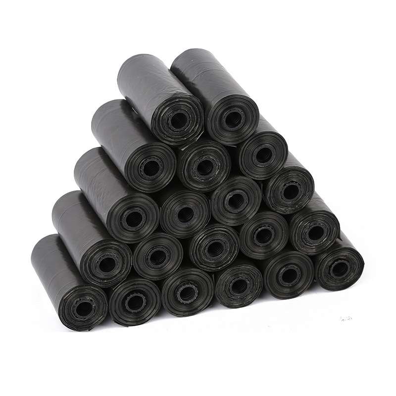 Stack of rolled black pet waste bags, bundled together