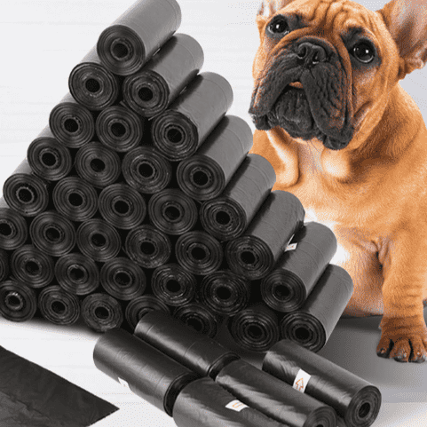 Black pet waste bag roll bundle in a thick stacked pile